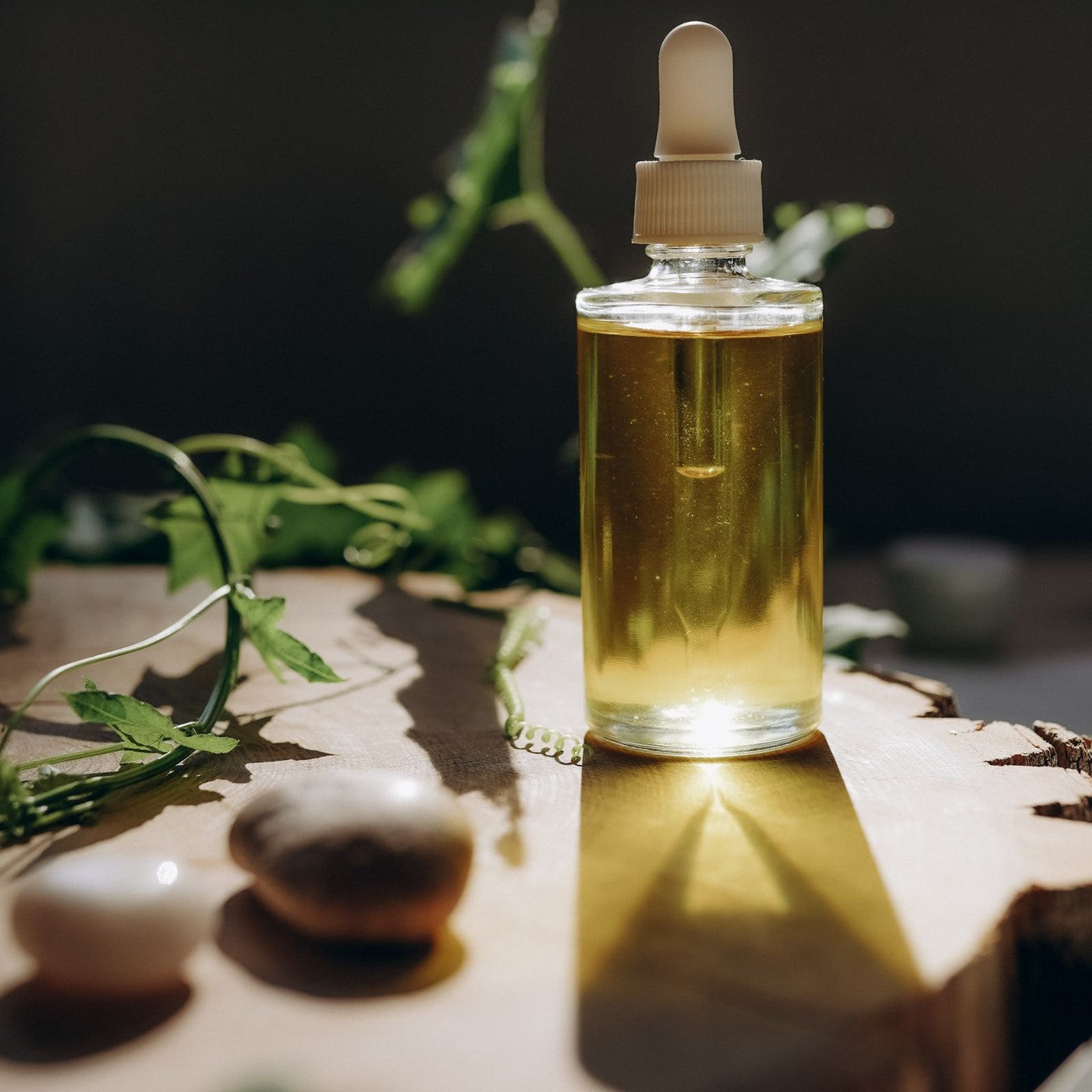 AuraMist aromatherapy oil in warm light